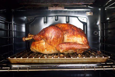Turkey on a roasting pan on top of a Baking Steel