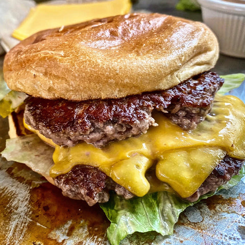Smash burger sizzling on Baking Steel Griddle