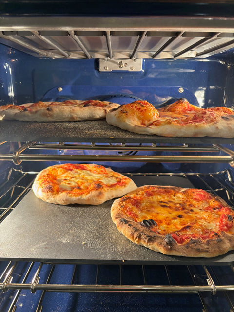 Two Baking Steels in a home oven with four pizzas baking at once