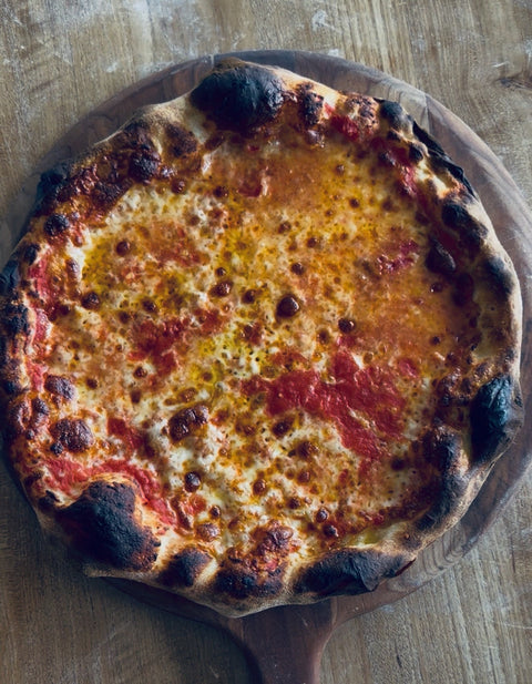 72 hour dough cooked on a Baking Steel, topped with crushed tomatoes and cheese