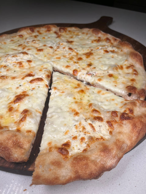 4 cheese white pizza baked on a Baking Steel
