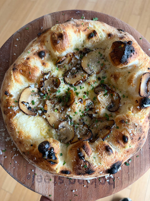 baby bella and fontina pizza, made on a Baking Steel.