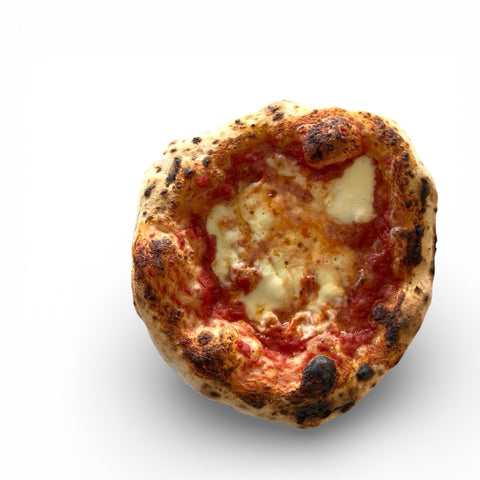 Neapolitan pizza baked on a Baking Steel in a home oven — leopard spotted crust with fresh mozzarella and San Marzano tomato sauce
