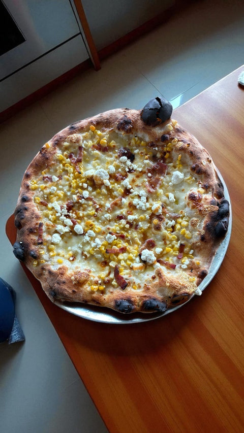 Summer pizza on a Baking Steel with fresh corn